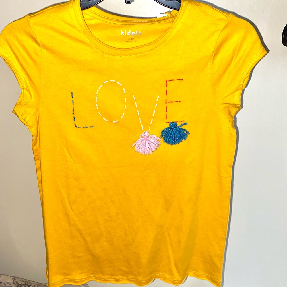 Kidpick yellow shirt with the word LOVE on it